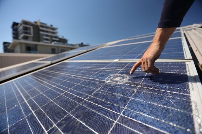 Solar Panel Damage With Worker