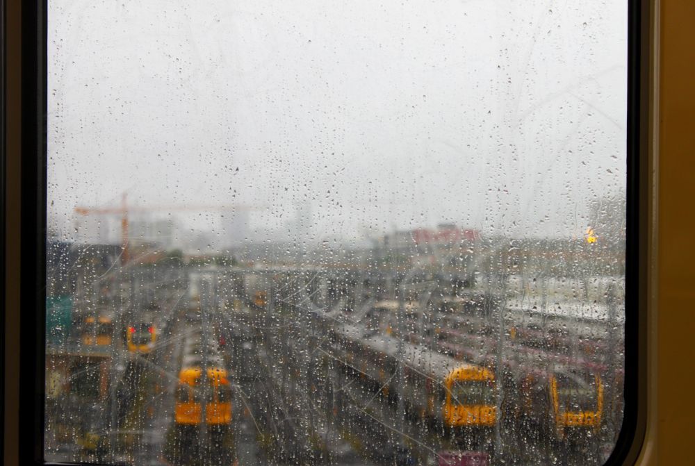 Trains through rainy window